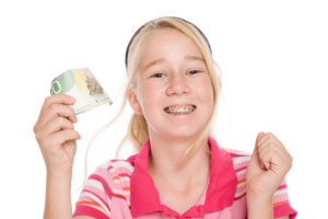 A girl shows money in hand.